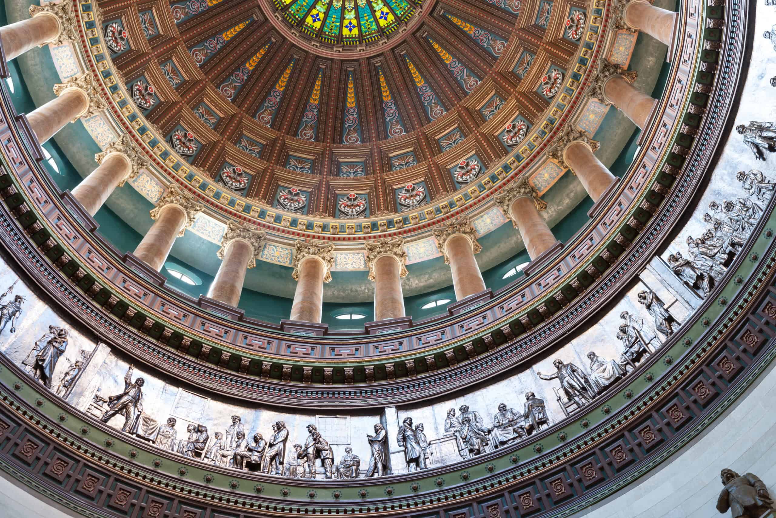Image looking up inside a dome building with a beautify mosaic
